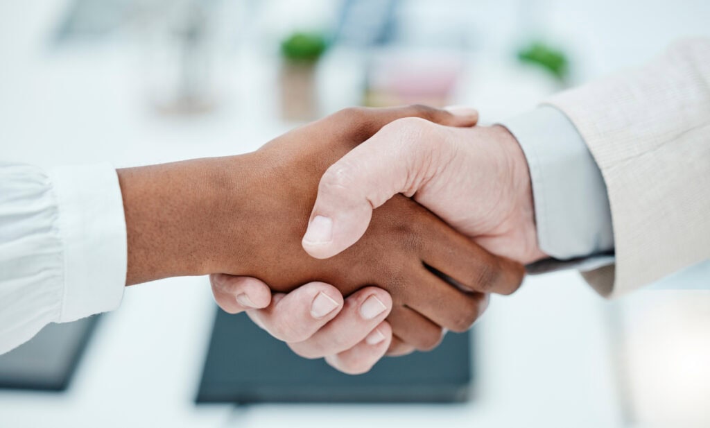 Shaking hands in the office for business meetings