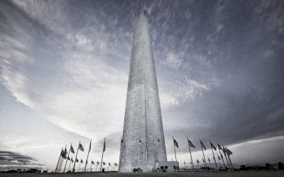 Washington Monument with american flags at sunset, Washington DC